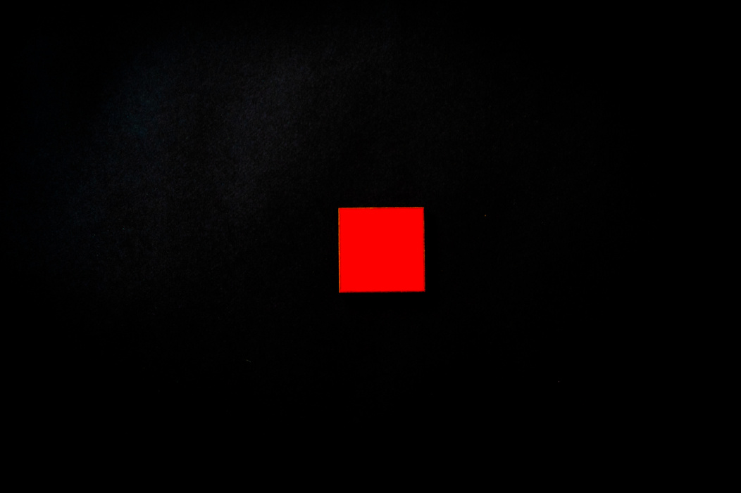 Red Square on Black Background
